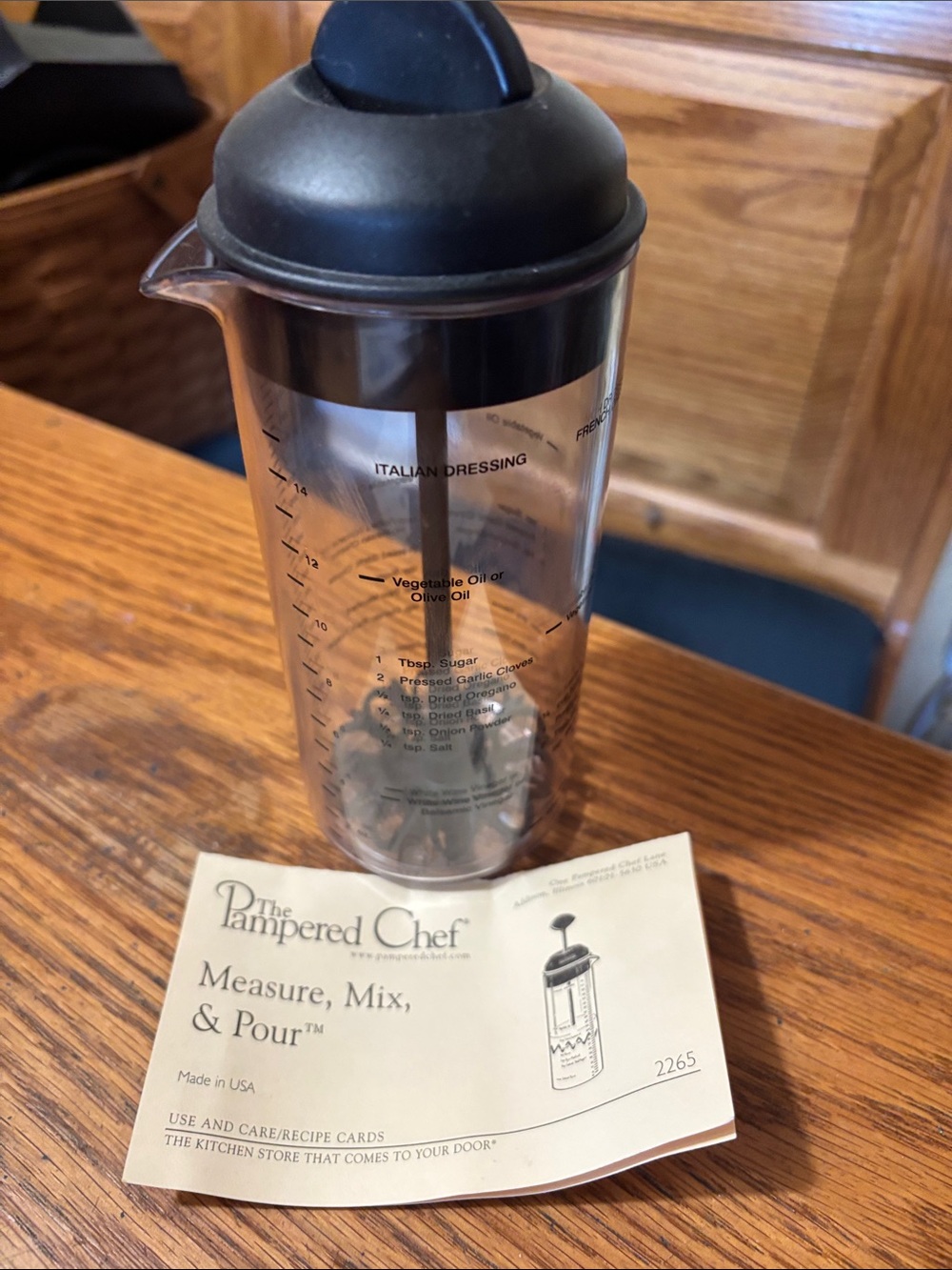 The Pampered Chef Dressing Mixer with Black Lid and Clear Body
